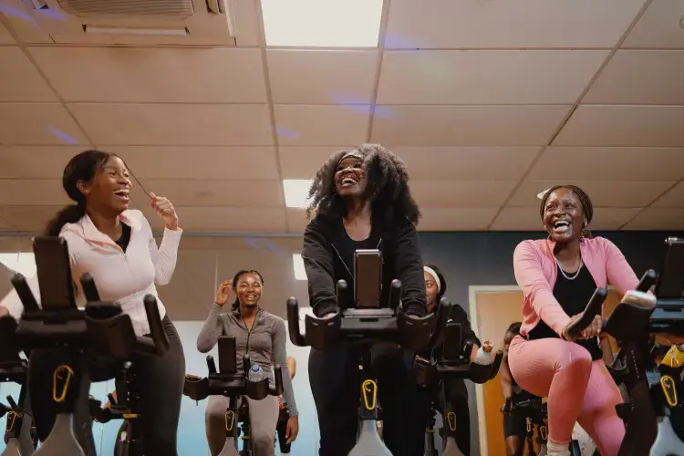 Students enjoying the Afrospin session on spin bikes